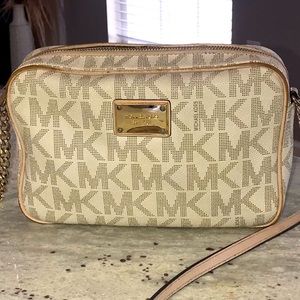 Authentic Michael Kors crossbody bag.  Gently loved.  Still in great condition